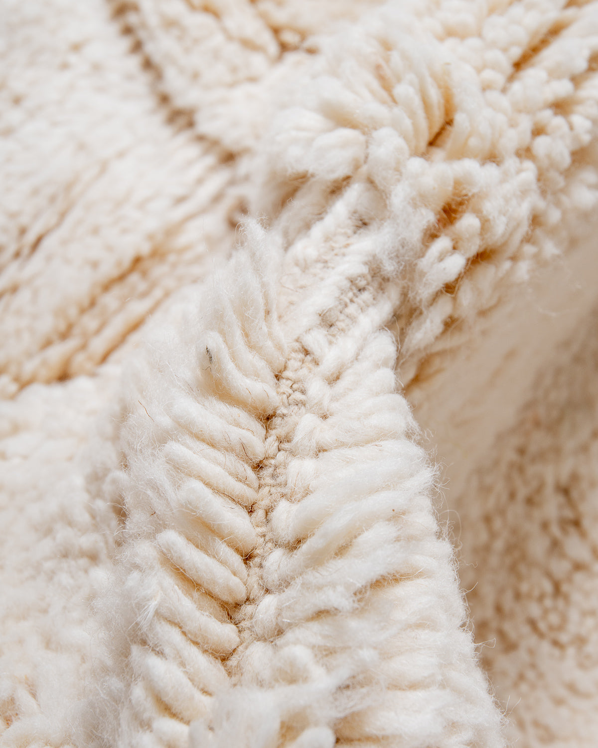 Modern, designer, handcrafted Berber rug from Morocco. Beniourain carpet with minimalist design, natural wool pile and a fluffy texture.