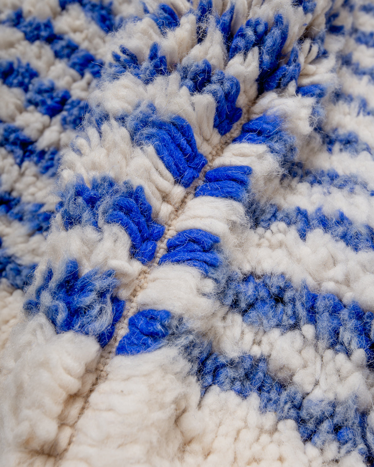 Modern, designer, handcrafted Berber rug from Morocco. Beniourain carpet with beautiful colours and patterns and fluffy wool texture.