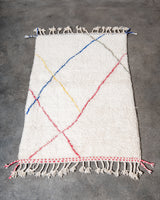 Modern, designer, handcrafted Berber rug from Morocco. Beniourain carpet with beautiful colours and patterns and fluffy wool texture. 