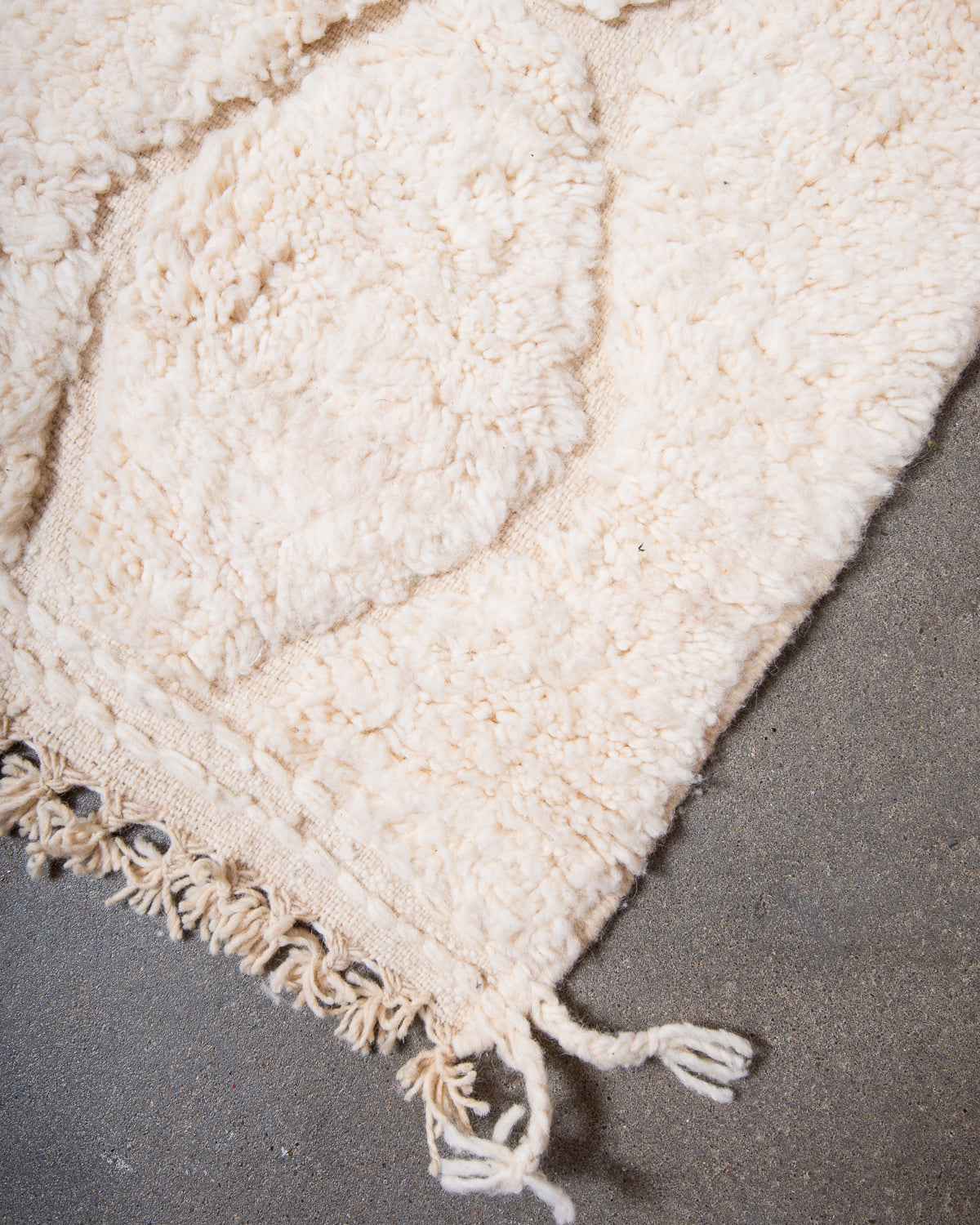 Modern, designer, handcrafted Berber rug from Morocco. Beniourain carpet with minimalist design, natural wool pile and a fluffy texture.