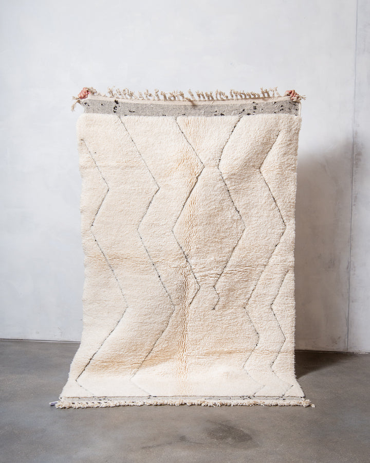Modern, designer, handcrafted Berber rug from Morocco. Beniourain carpet with minimalist design, natural wool pile and a fluffy texture.