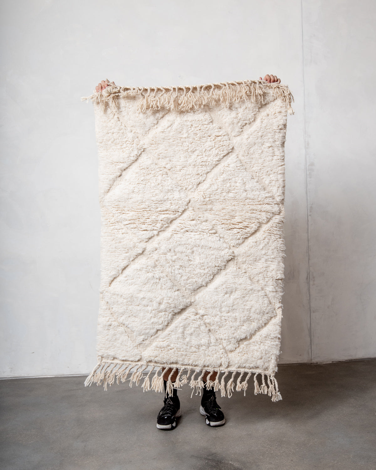 Modern, designer, handcrafted Berber rug from Morocco. Beniourain carpet with minimalist design, natural wool pile and a fluffy texture.