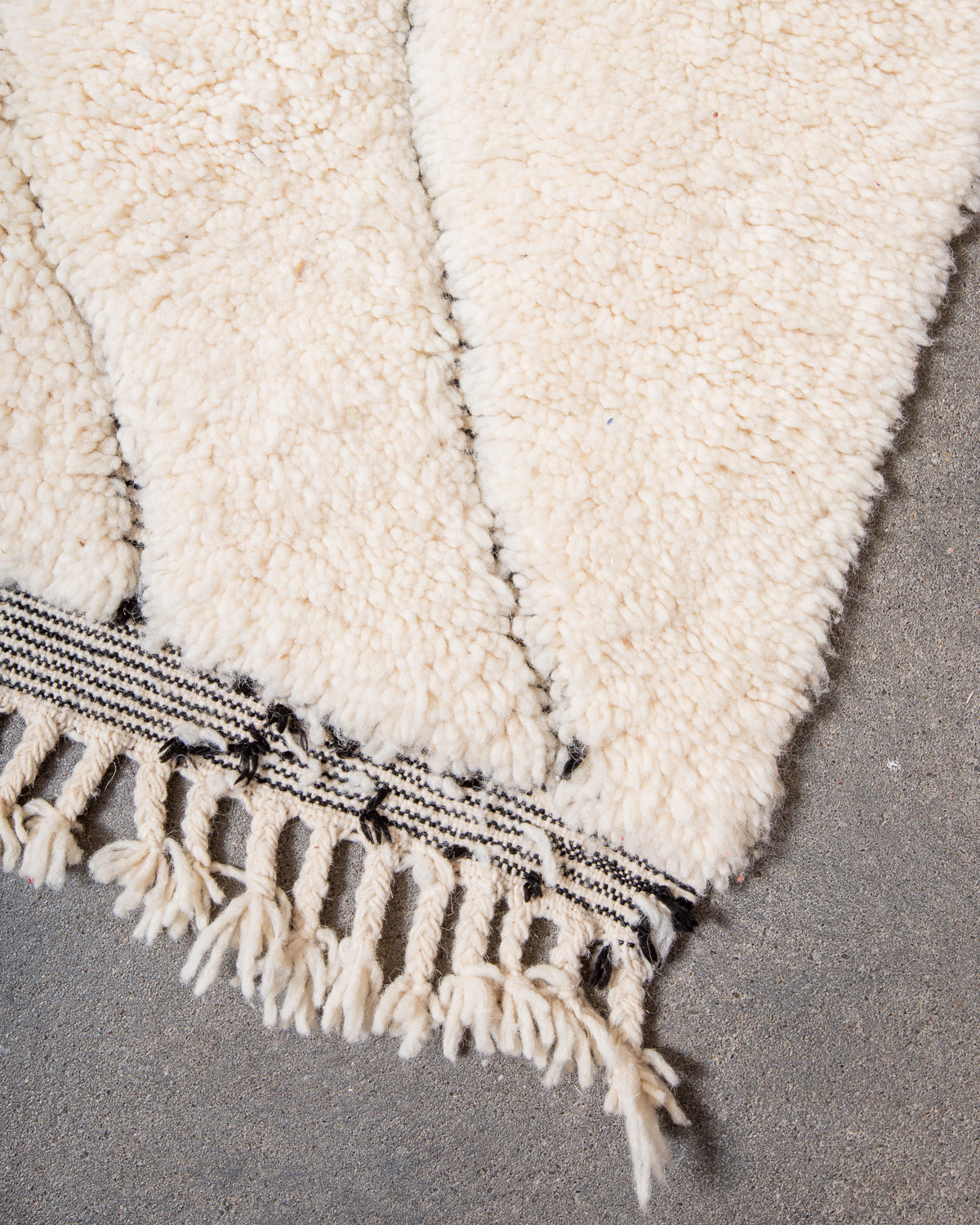 Modern, designer, handcrafted Berber rug from Morocco. Beniourain carpet with minimalist design, natural wool pile and a fluffy texture.