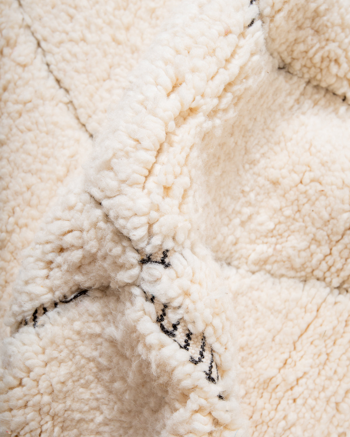 Modern, designer, handcrafted Berber rug from Morocco. Beniourain carpet with minimalist design, natural wool pile and a fluffy texture.