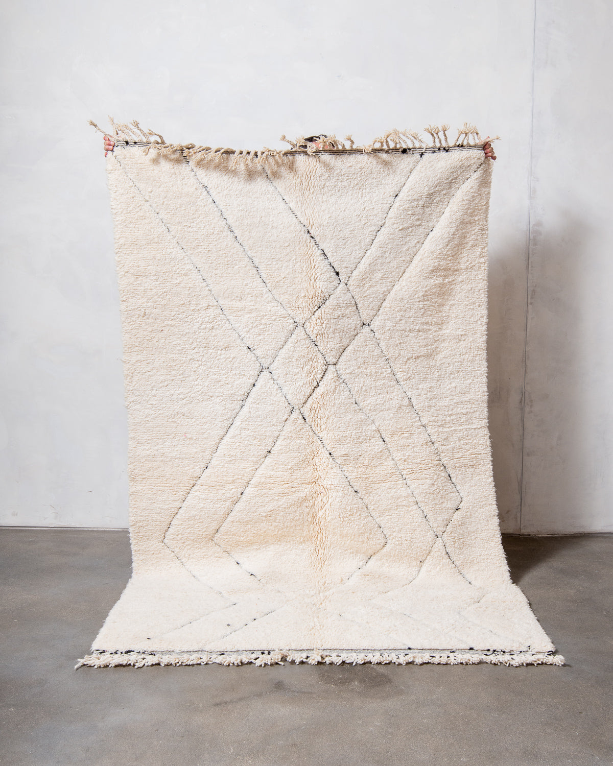 Modern, designer, handcrafted Berber rug from Morocco. Beniourain carpet with minimalist design, natural wool pile and a fluffy texture.