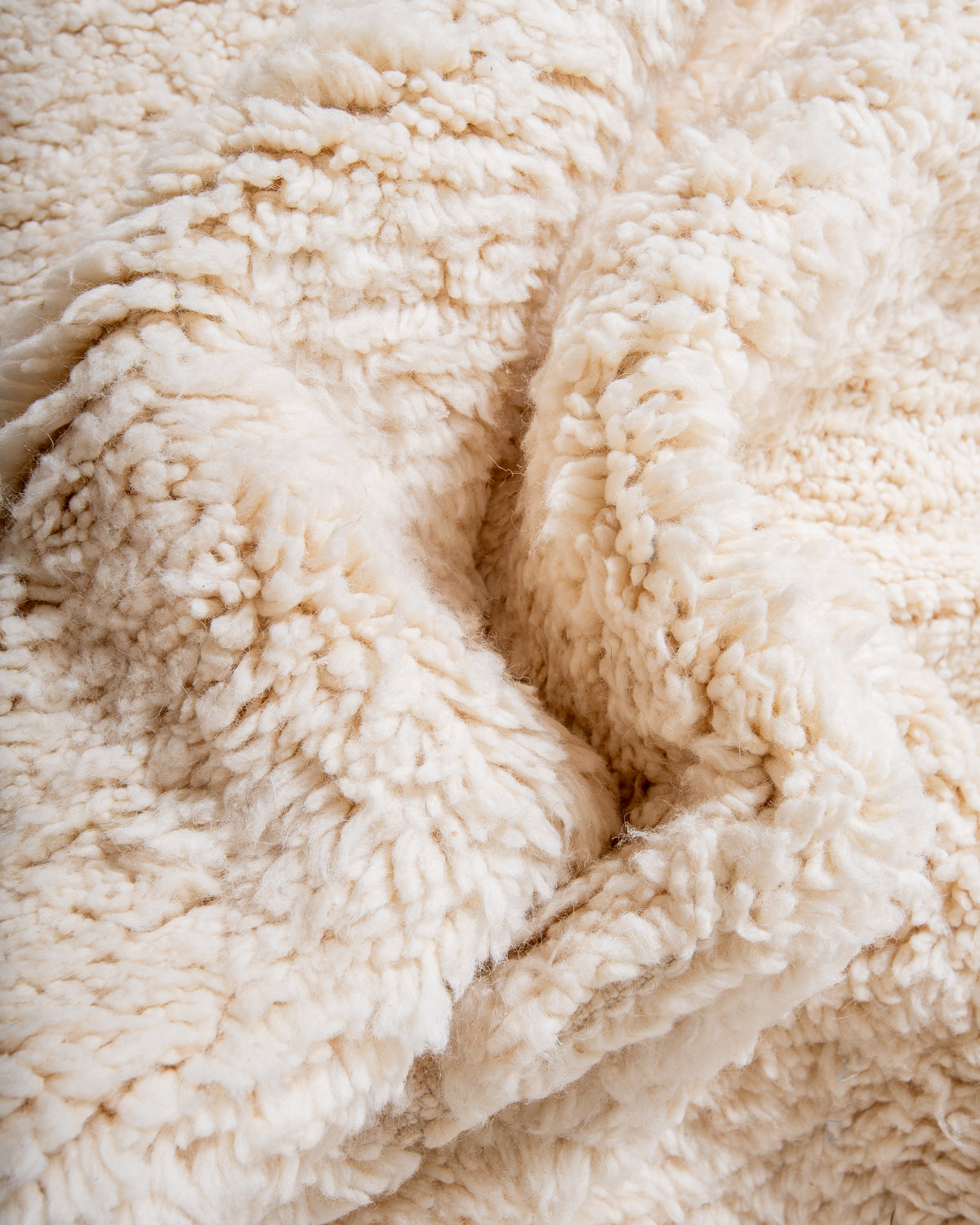 Modern, designer, handcrafted Berber rug from Morocco. Beniourain carpet with minimalist design, natural wool pile and a fluffy texture.