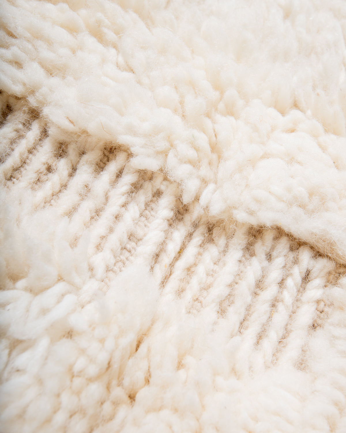 Close up of cream wool Beniourain rug.