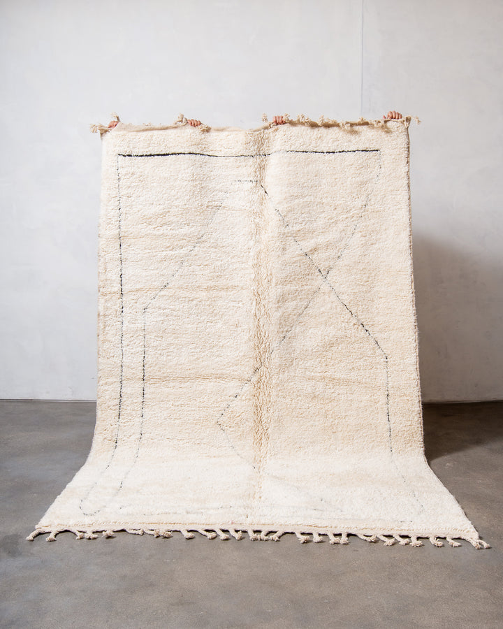 Modern, designer, handcrafted Berber rug from Morocco. Beniourain carpet with minimalist design, natural wool pile and a fluffy texture.
