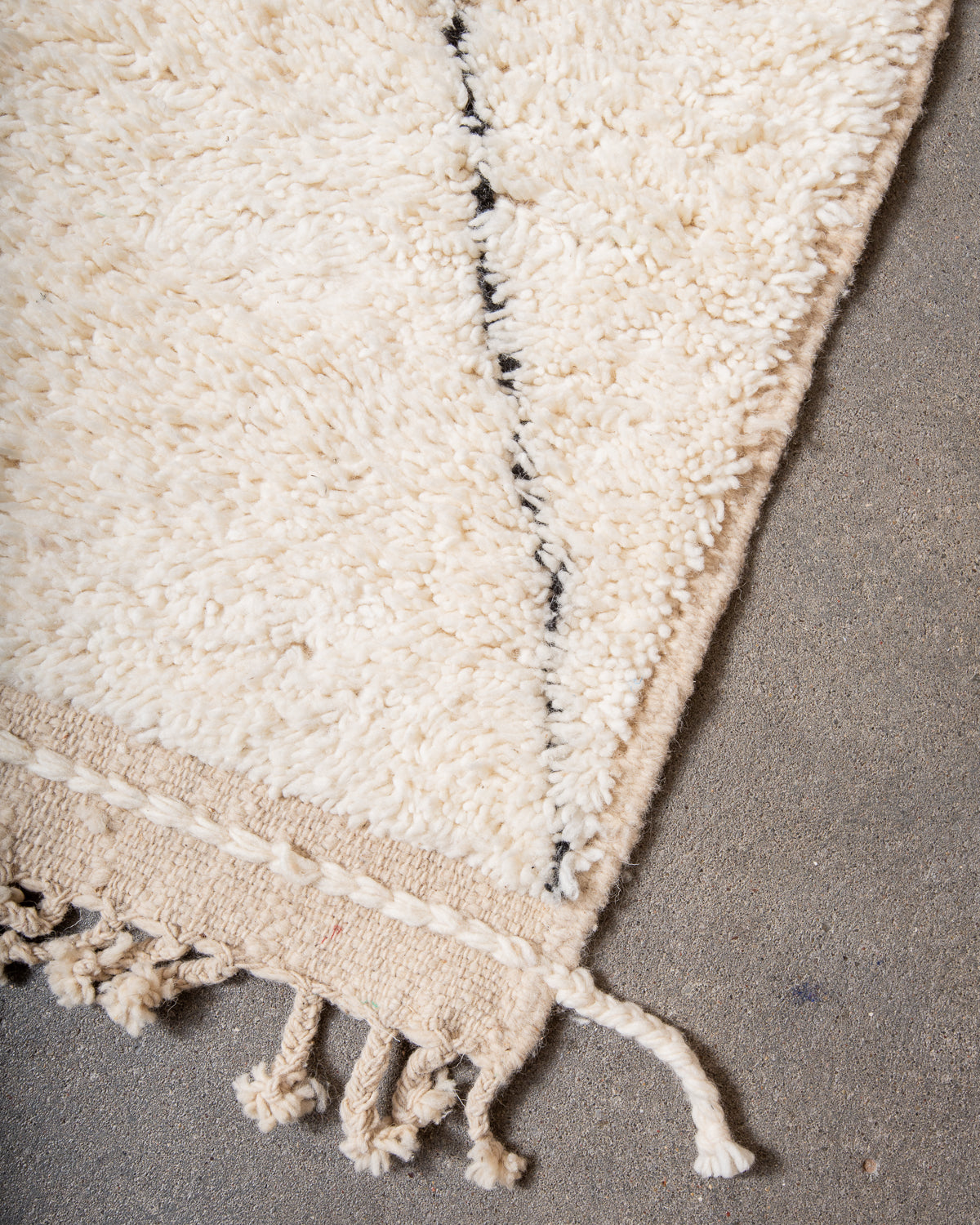 Modern, designer, handcrafted Berber rug from Morocco. Beniourain carpet with minimalist design, natural wool pile and a fluffy texture.