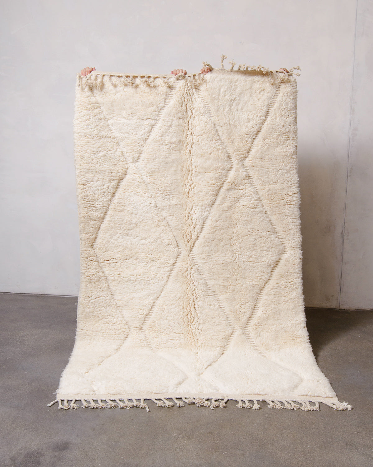 Modern, designer, handcrafted Berber rug from Morocco. Beniourain carpet with minimalist design, natural wool pile and a fluffy texture.