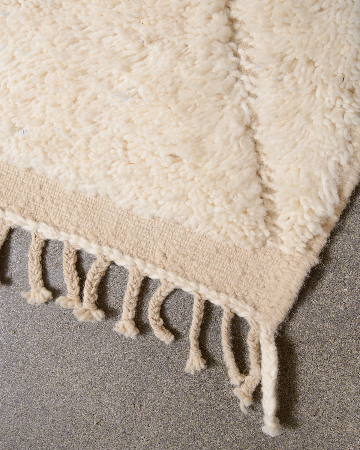 Modern, designer, handcrafted Berber rug from Morocco. Beniourain carpet with minimalist design, natural wool pile and a fluffy texture.