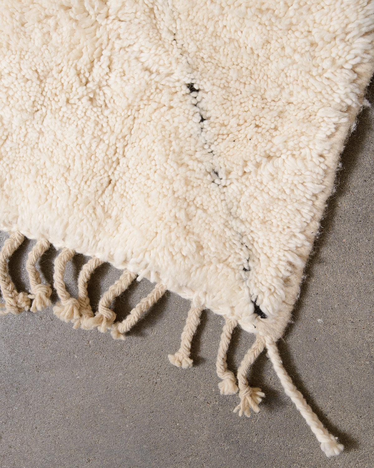 Modern, designer, handcrafted Berber rug from Morocco. Beniourain carpet with minimalist design, natural wool pile and a fluffy texture.