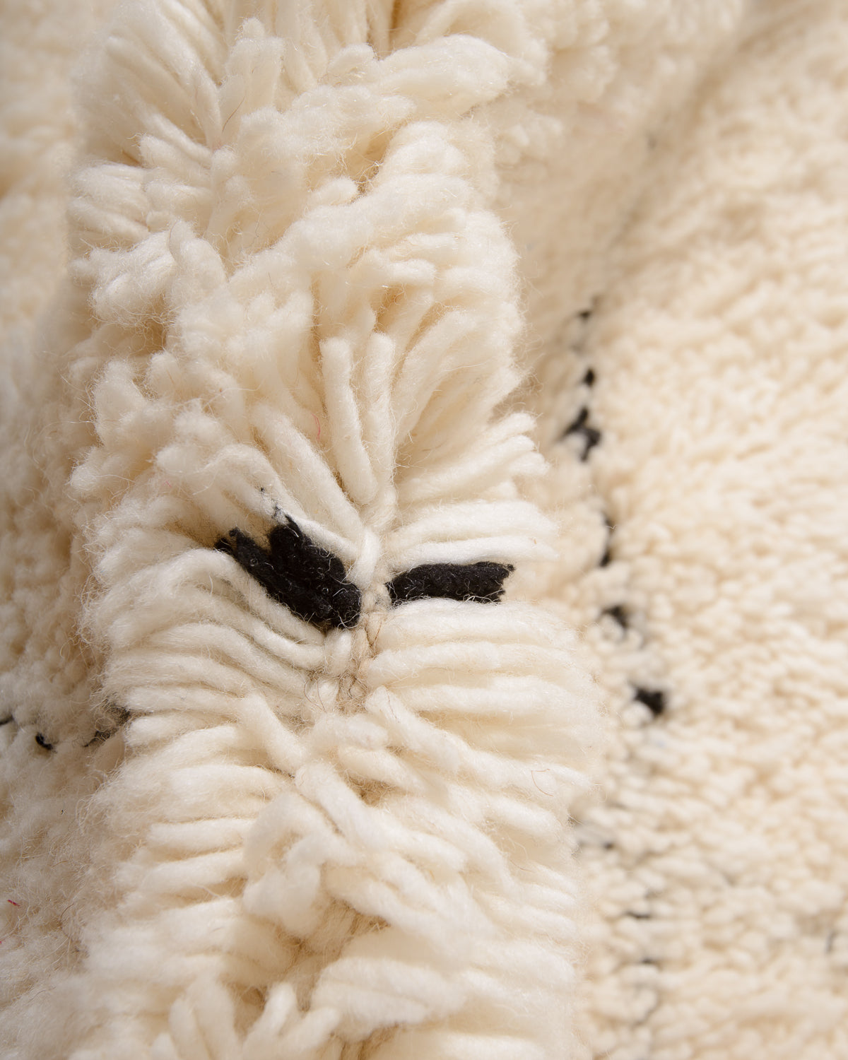 Modern, designer, handcrafted Berber rug from Morocco. Beniourain carpet with minimalist design, natural wool pile and a fluffy texture.