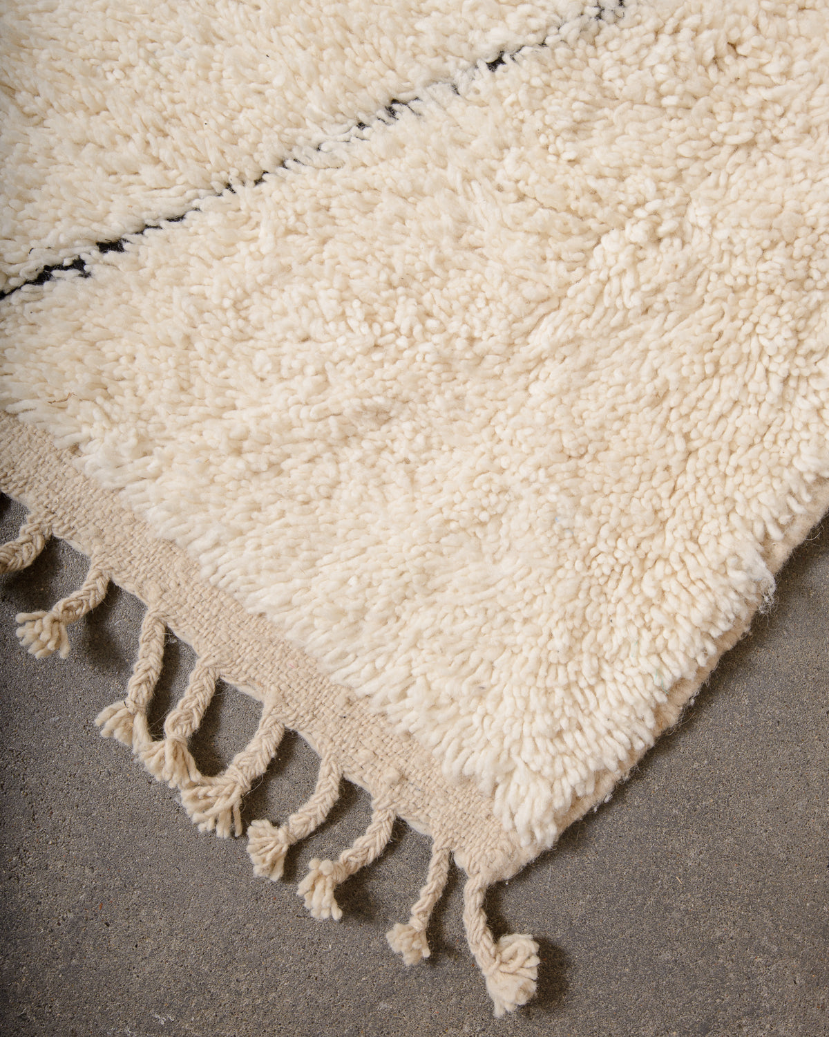 Modern, designer, handcrafted Berber rug from Morocco. Beniourain carpet with minimalist design, natural wool pile and a fluffy texture.