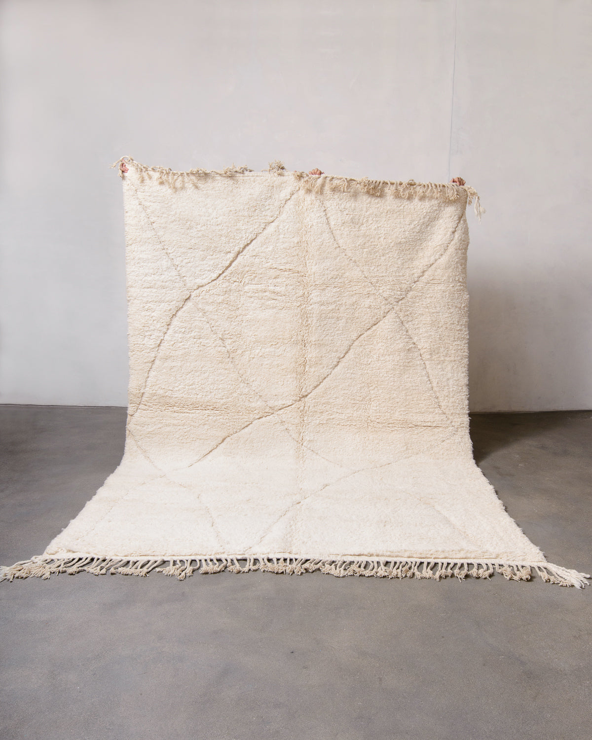 Modern, designer, handcrafted Berber rug from Morocco. Beniourain carpet with minimalist design, natural wool pile and a fluffy texture.