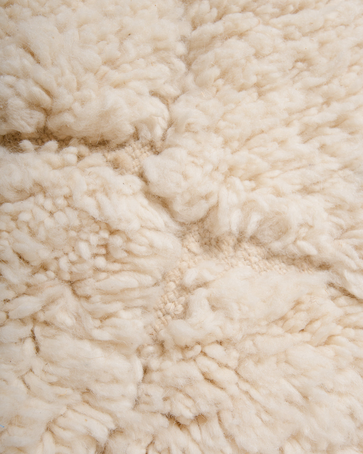 Modern, designer, handcrafted Berber rug from Morocco. Beniourain carpet with minimalist design, natural wool pile and a fluffy texture.