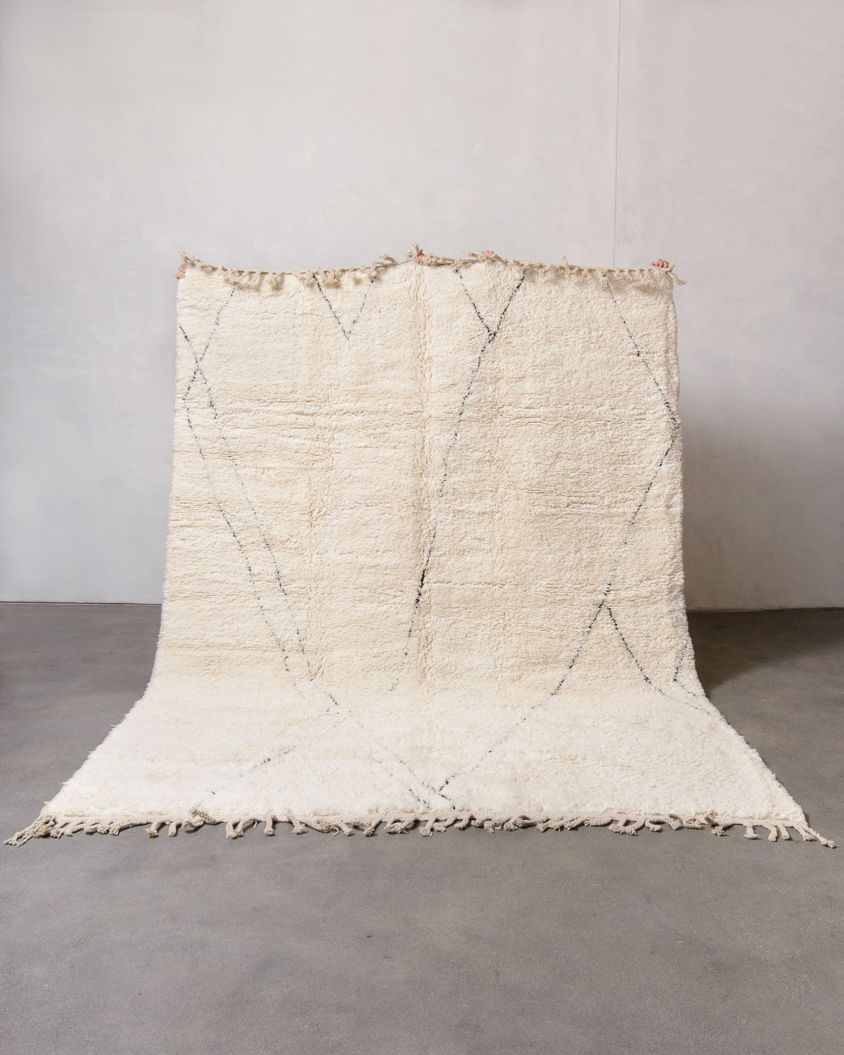 Modern, designer, handcrafted Berber rug from Morocco. Beniourain carpet with minimalist design, natural wool pile and a fluffy texture.