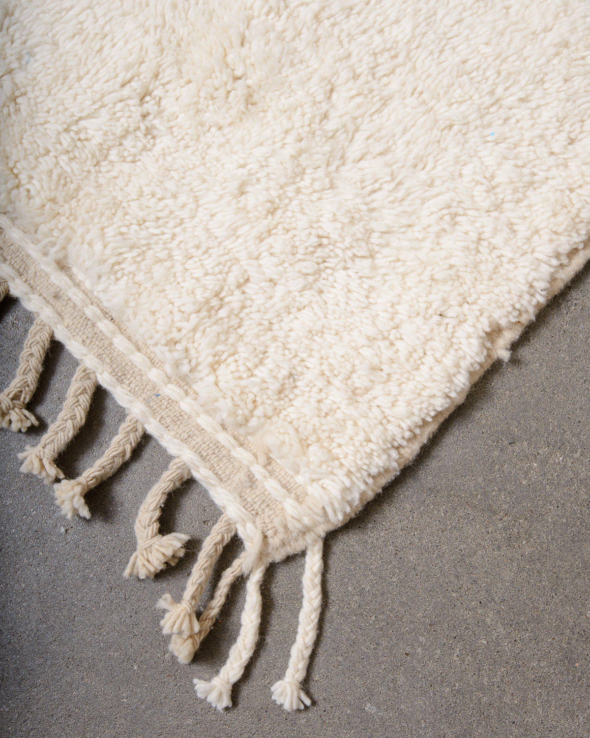 Modern, designer, handcrafted Berber rug from Morocco. Beniourain carpet with minimalist design, natural wool pile and a fluffy texture.