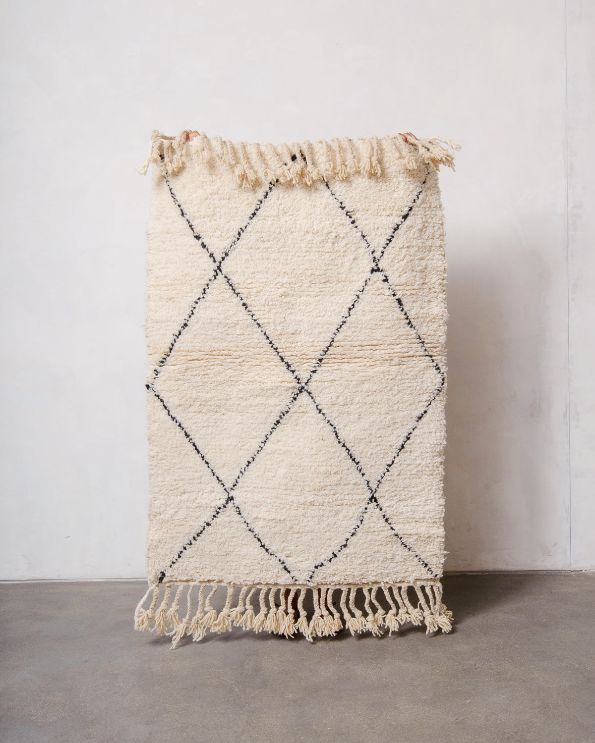 Modern, designer, handcrafted Berber rug from Morocco. Beniourain carpet with minimalist design, natural wool pile and a fluffy texture.