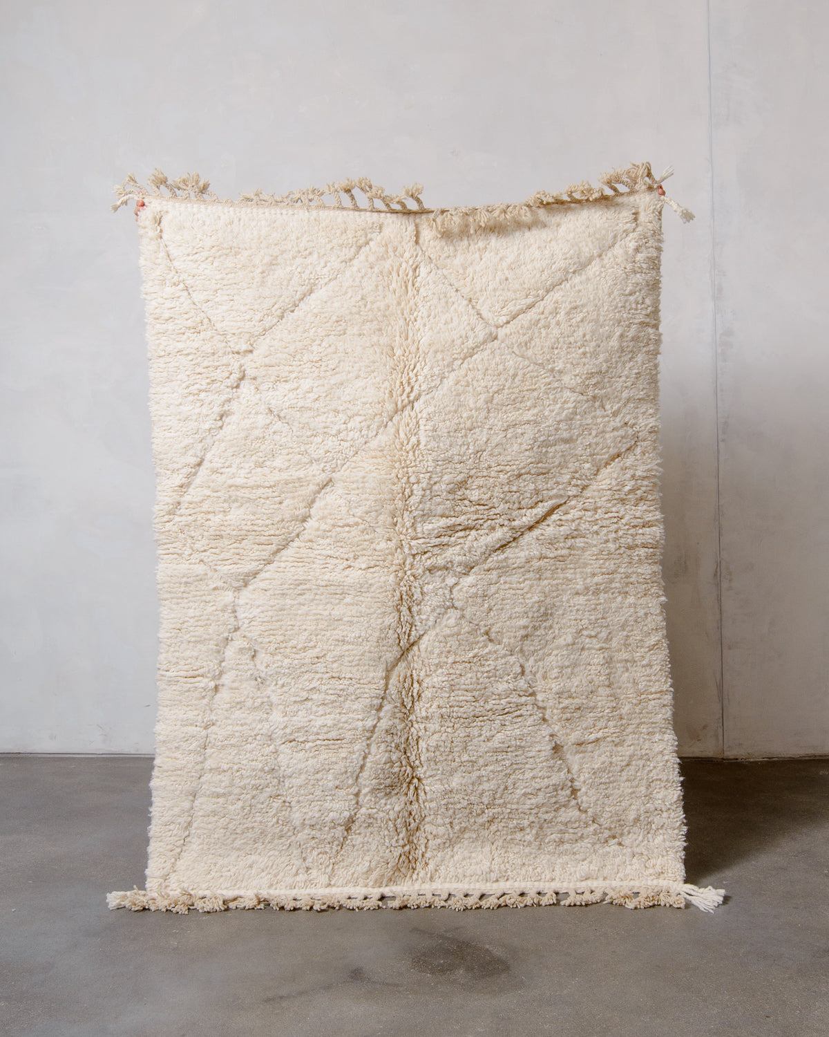 Modern, designer, handcrafted Berber rug from Morocco. Beniourain carpet with minimalist design, natural wool pile and a fluffy texture.