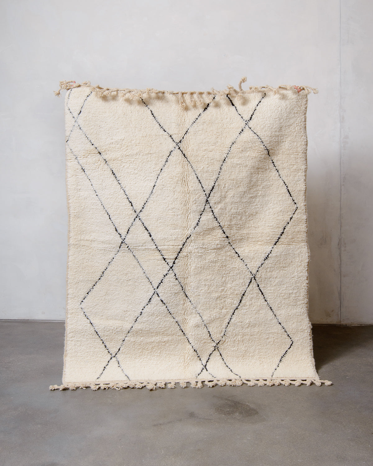 Modern, designer, handcrafted Berber rug from Morocco. Beniourain carpet with minimalist design, natural wool pile and a fluffy texture.