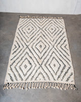 Modern, designer, handcrafted Berber rug from Morocco. Beniourain carpet with minimalist design, natural wool pile and a fluffy texture.