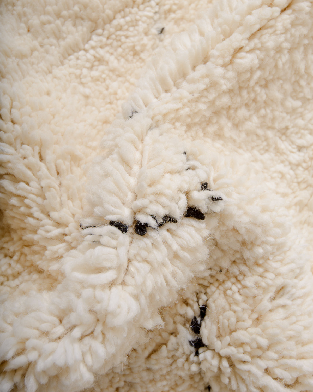 Modern, designer, handcrafted Berber rug from Morocco. Beniourain carpet with minimalist design, natural wool pile and a fluffy texture.