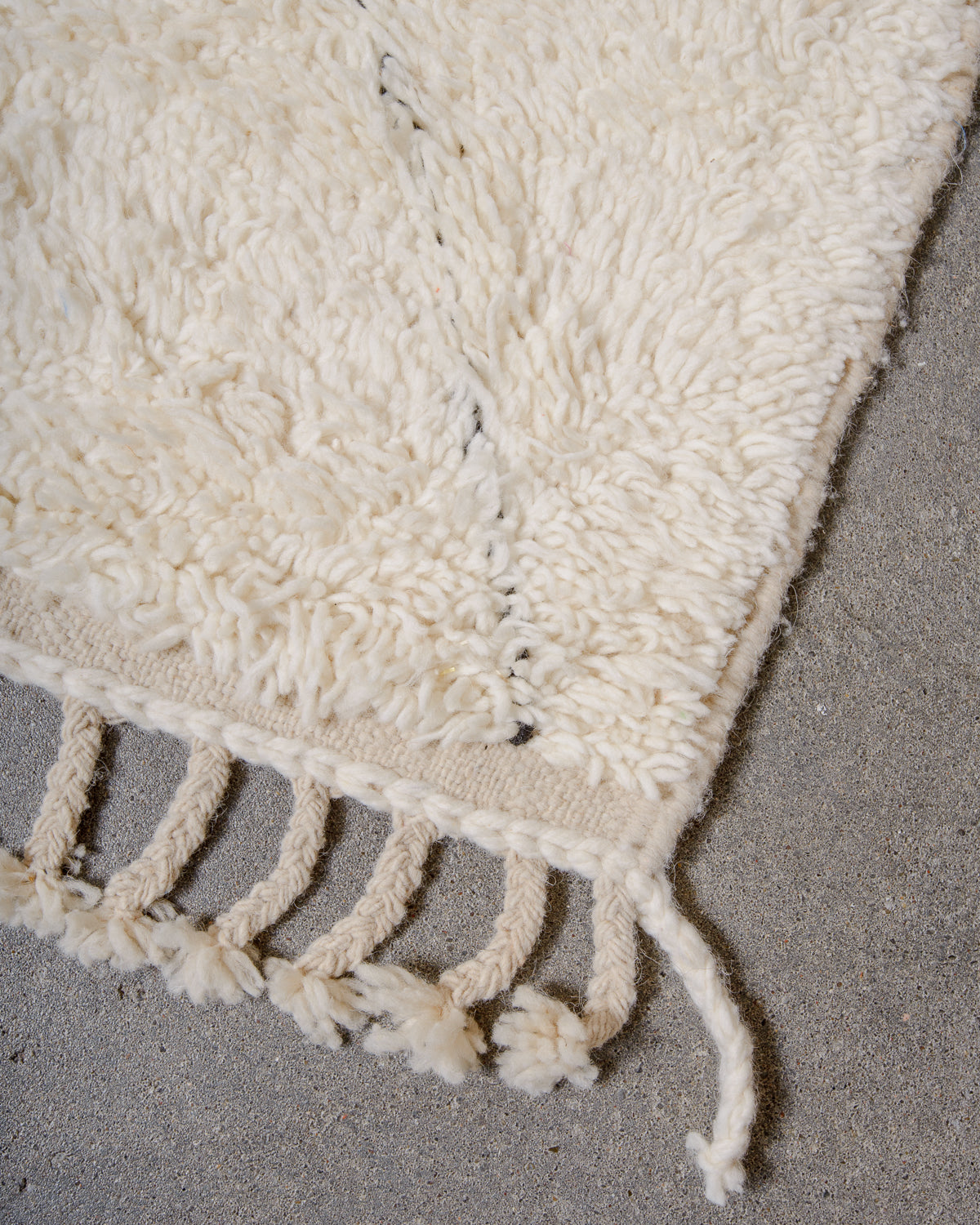 Modern, designer, handcrafted Berber rug from Morocco. Beniourain carpet with minimalist design, natural wool pile and a fluffy texture.