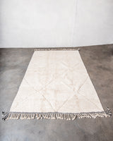 Modern, designer, handcrafted Berber rug from Morocco. Beniourain carpet with minimalist design, natural wool pile and a fluffy texture.