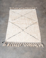 Modern, designer, handcrafted Berber rug from Morocco. Beniourain carpet with minimalist design, natural wool pile and a fluffy texture.