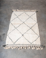 Modern, designer, handcrafted Berber rug from Morocco. Beniourain carpet with minimalist design, natural wool pile and a fluffy texture.