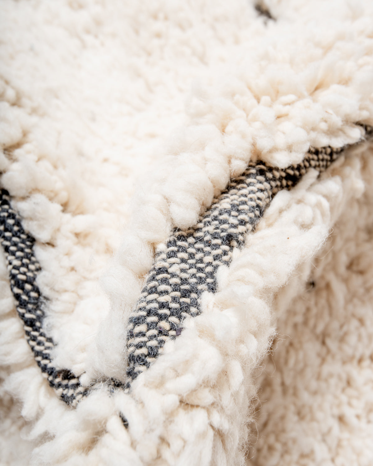 Modern, designer, handcrafted Berber rug from Morocco. Beniourain carpet with minimalist design, natural wool pile and a fluffy texture.