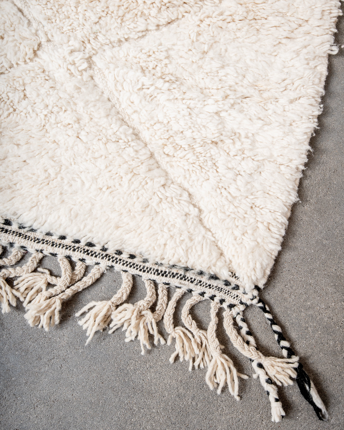 Modern, designer, handcrafted Berber rug from Morocco. Beniourain carpet with minimalist design, natural wool pile and a fluffy texture.