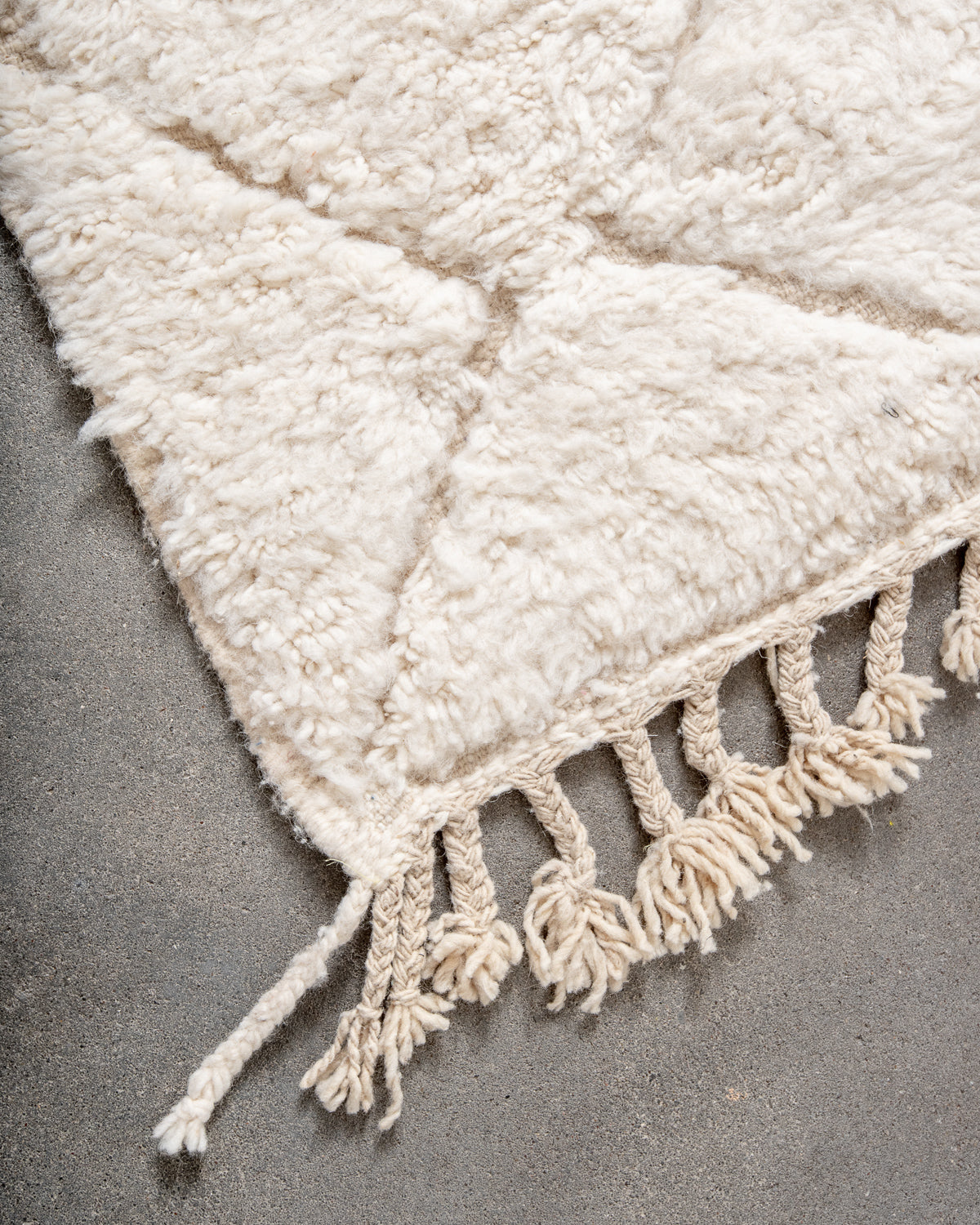 Modern, designer, handcrafted Berber rug from Morocco. Beniourain carpet with minimalist design, natural wool pile and a fluffy texture.
