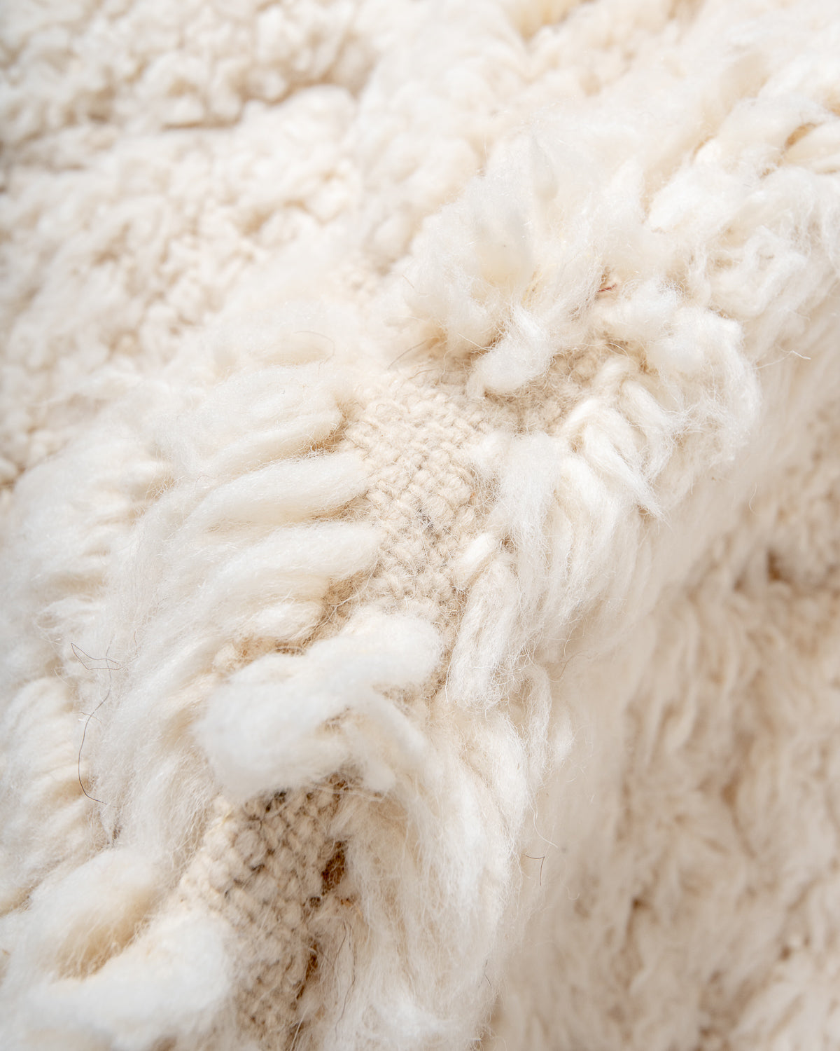 Modern, designer, handcrafted Berber rug from Morocco. Beniourain carpet with minimalist design, natural wool pile and a fluffy texture.