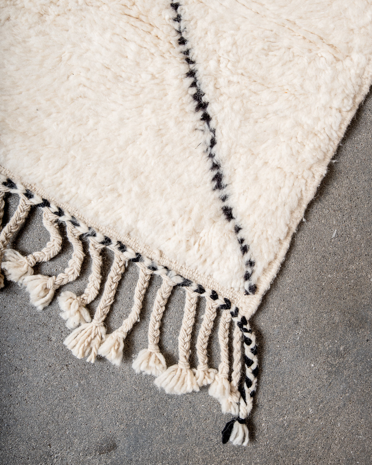 Modern, designer, handcrafted Berber rug from Morocco. Beniourain carpet with minimalist design, natural wool pile and a fluffy texture.
