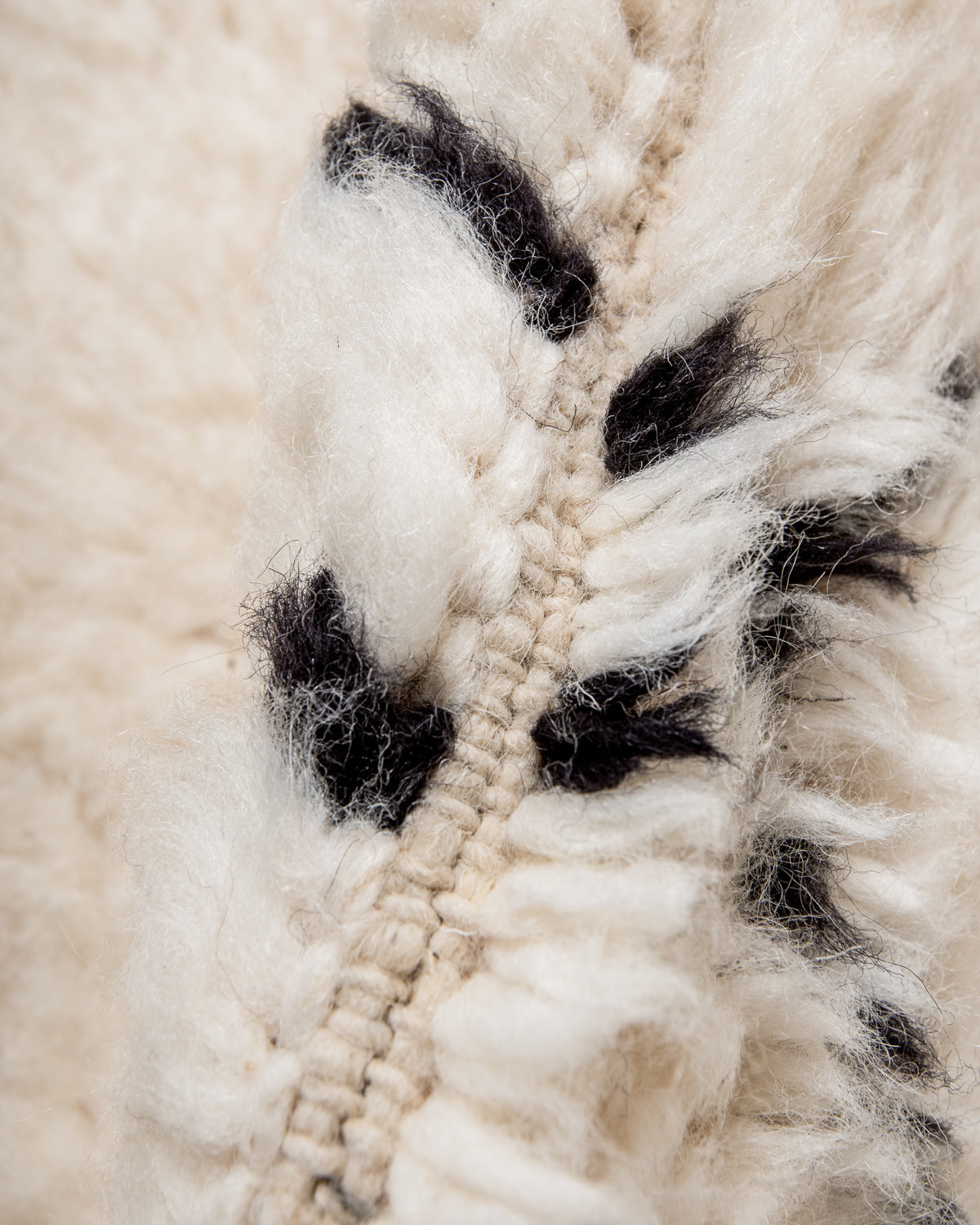 Modern, designer, handcrafted Berber rug from Morocco. Beniourain carpet with minimalist design, natural wool pile and a fluffy texture.