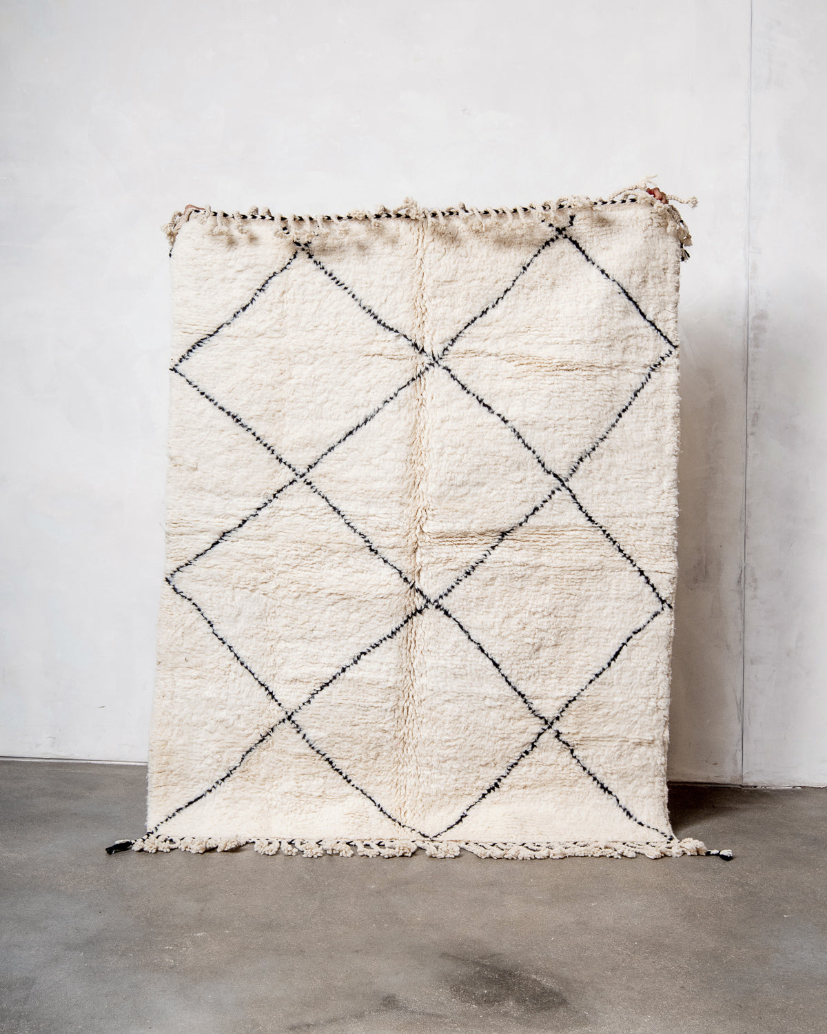 Modern, designer, handcrafted Berber rug from Morocco. Beniourain carpet with minimalist design, natural wool pile and a fluffy texture.