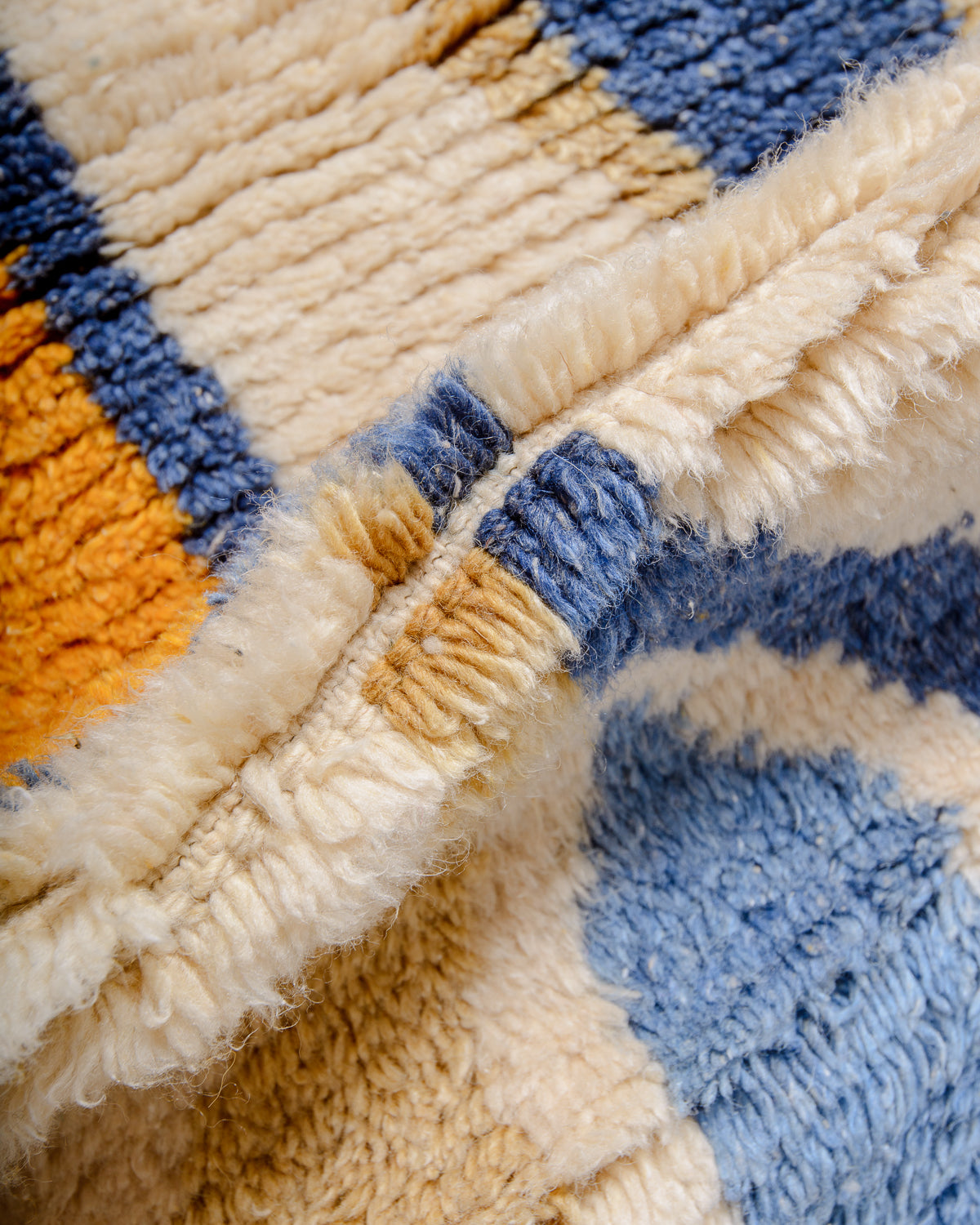 Modern, designer, handcrafted Berber runner rug from Morocco. Beniourain carpet with beautiful colours and patterns and fluffy wool texture.