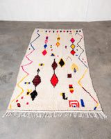 Modern designer handcrafted Berber rug from Morocco. Azilal rug with beautiful colors and patterns. Made of sheep’s wool and colourful cotton.