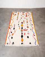 Modern designer handcrafted Berber rug from Morocco. Azilal rug with beautiful colors and patterns. Made of sheep’s wool and colourful cotton.
