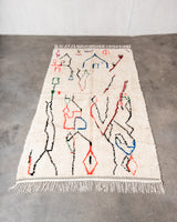 Modern designer handcrafted Berber rug from Morocco. Azilal rug with beautiful colors and patterns. Made of sheep’s wool and colourful cotton.