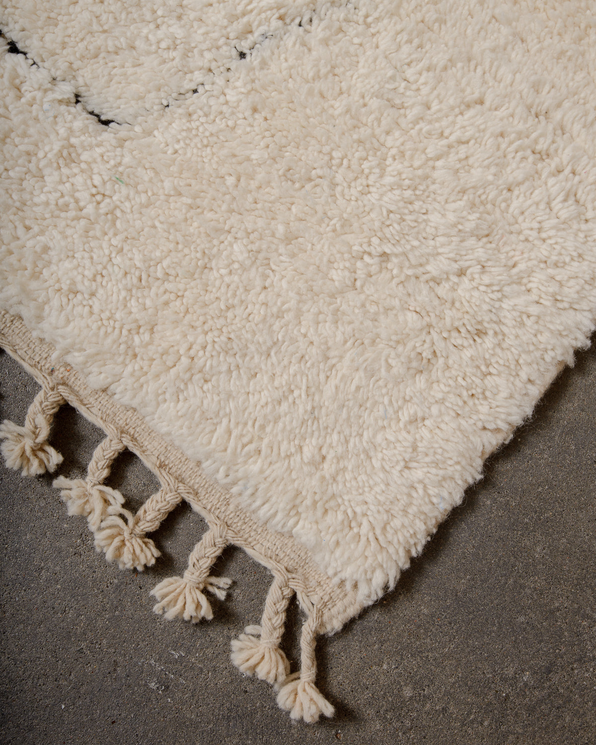 Modern, designer, handcrafted Berber rug from Morocco. Beniourain carpet with minimalist design, natural wool pile and a fluffy texture.