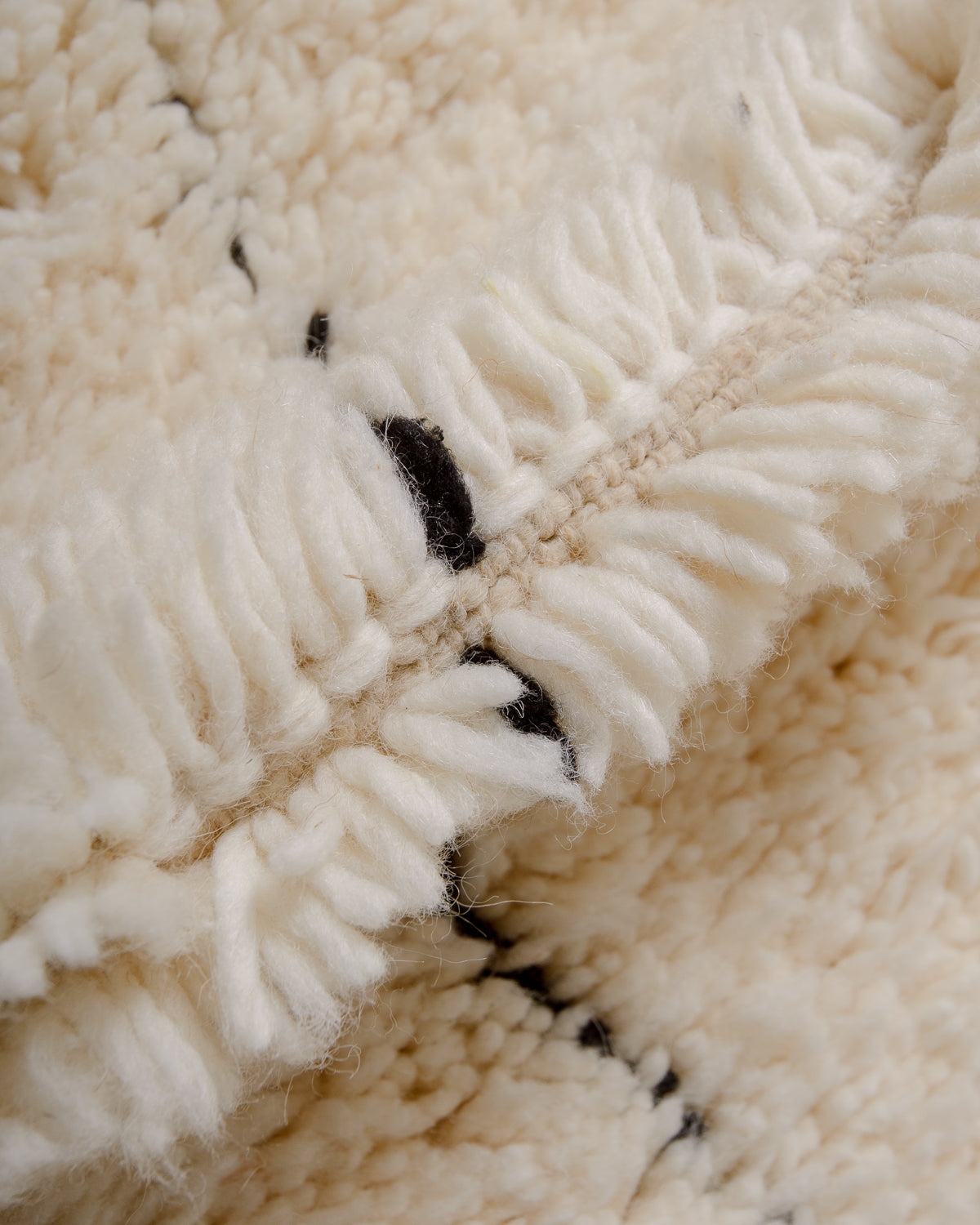 Modern, designer, handcrafted Berber rug from Morocco. Beniourain carpet with minimalist design, natural wool pile and a fluffy texture.