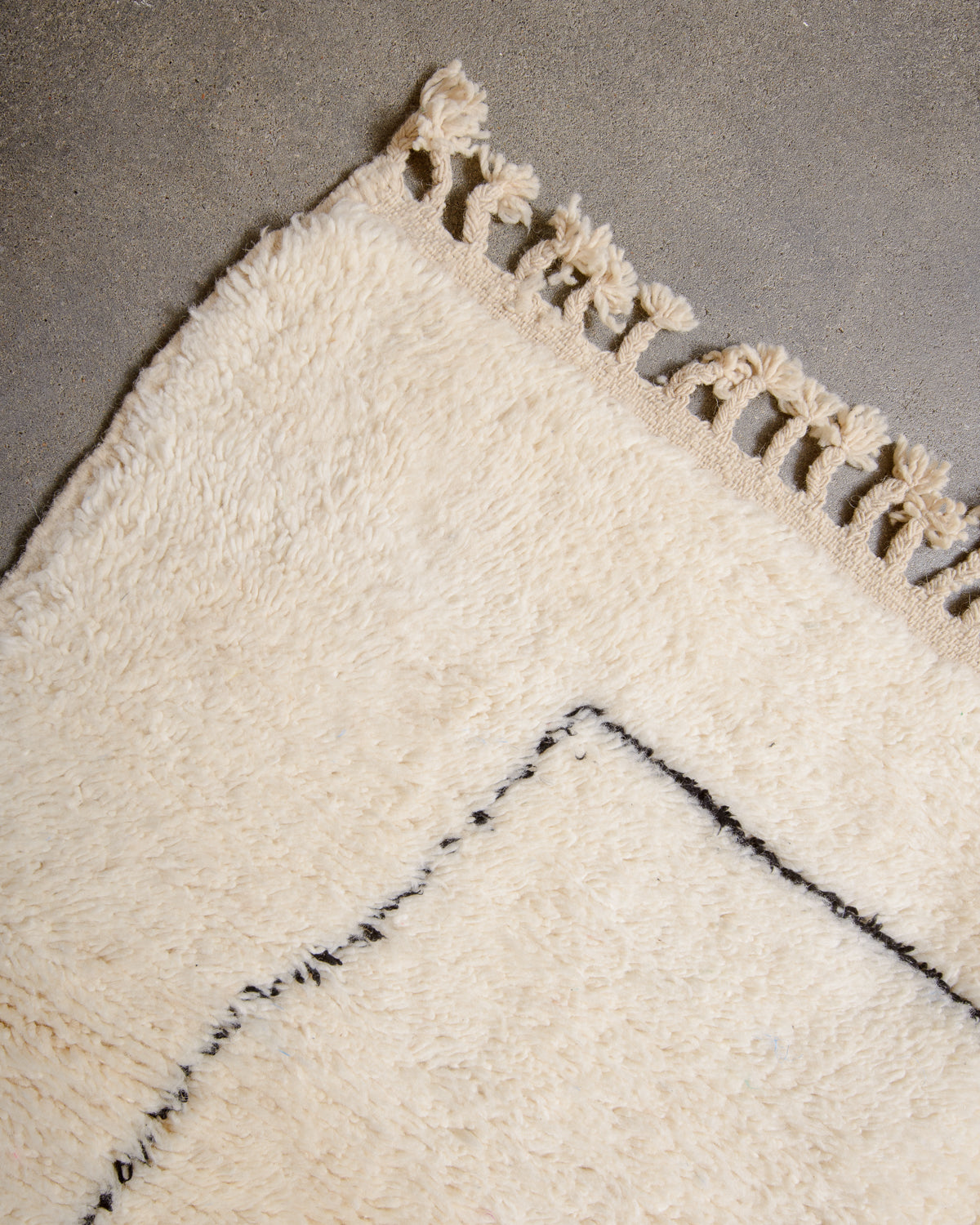 Modern, designer, handcrafted Berber rug from Morocco. Beniourain carpet with minimalist design, natural wool pile and a fluffy texture.