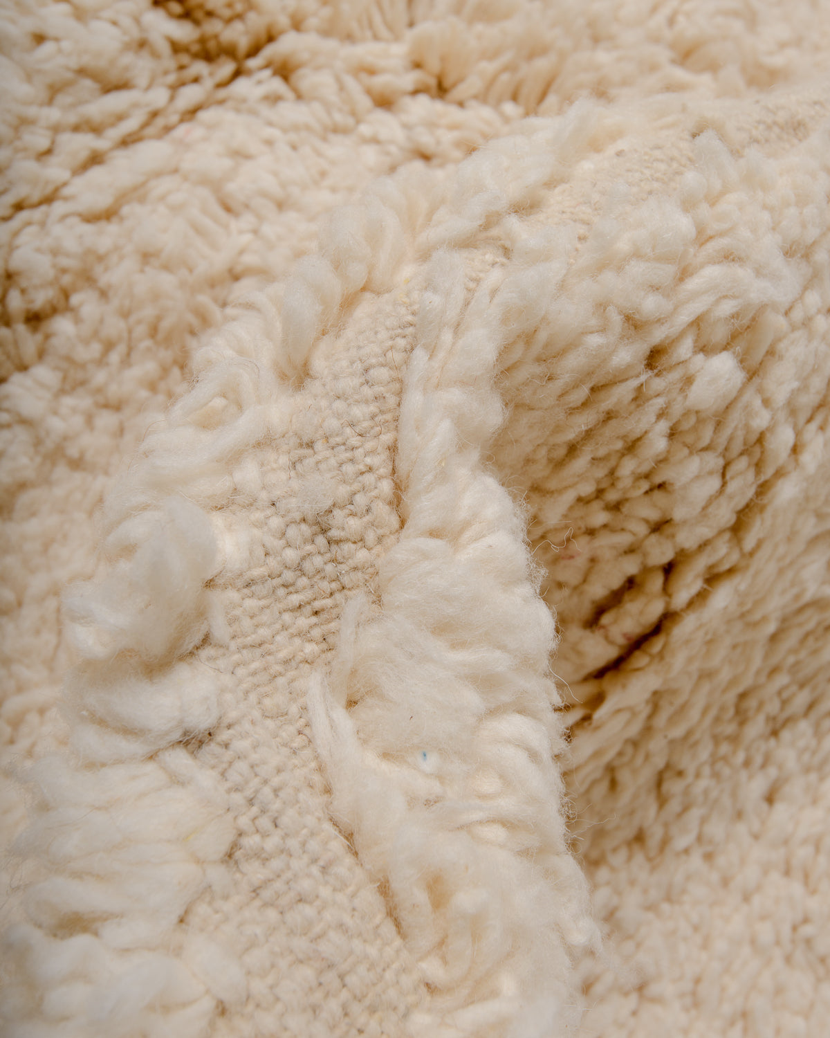 Modern, designer, handcrafted Berber rug from Morocco. Beniourain carpet with minimalist design, natural wool pile and a fluffy texture.