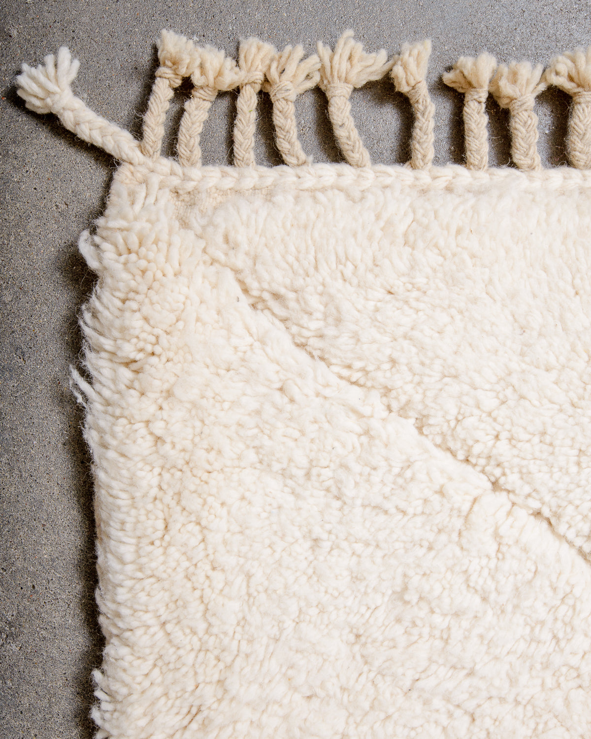 Modern, designer, handcrafted Berber rug from Morocco. Beniourain carpet with minimalist design, natural wool pile and a fluffy texture.