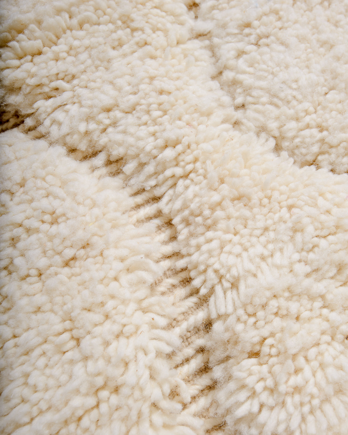 Modern, designer, handcrafted Berber rug from Morocco. Beniourain carpet with minimalist design, natural wool pile and a fluffy texture.