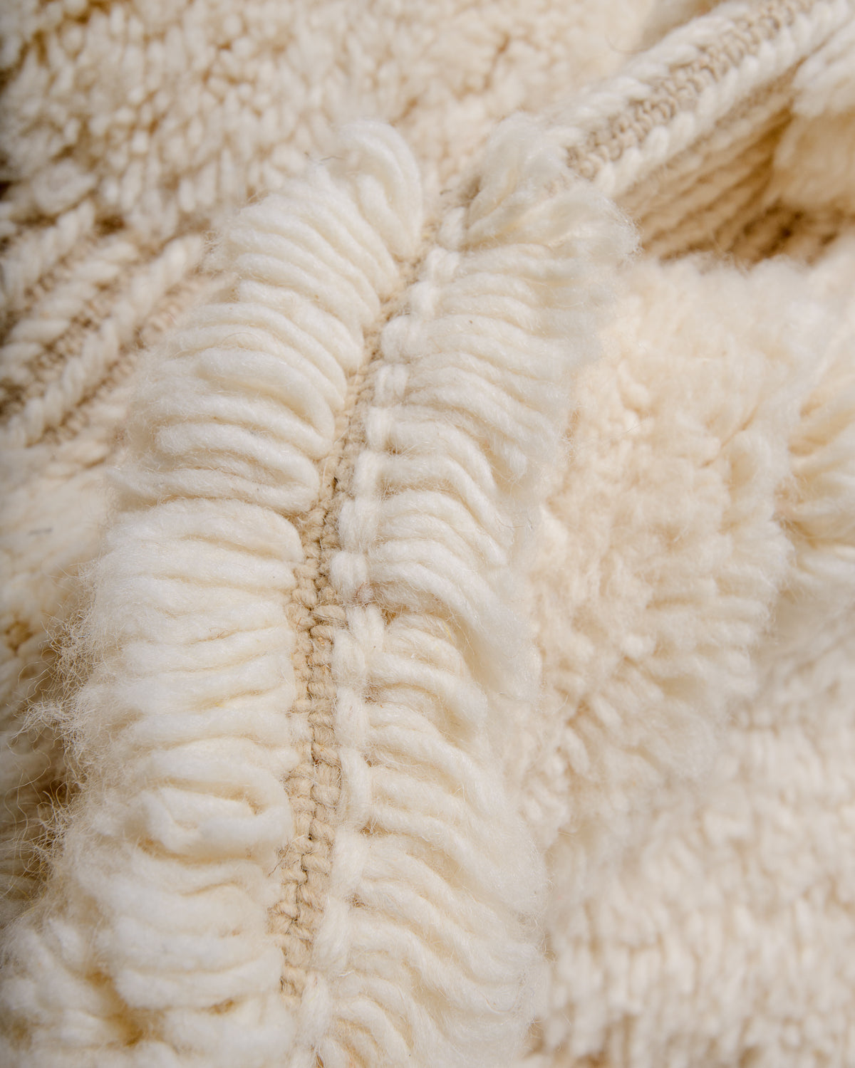 Modern, designer, handcrafted Berber rug from Morocco. Beniourain carpet with minimalist design, natural wool pile and a fluffy texture.