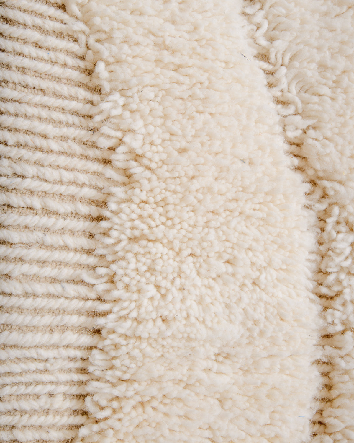 Close up of cream wool Beniourain rug.